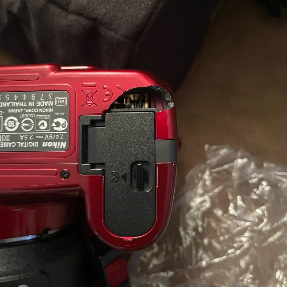 Nikon D3100 new camera has 2 batteries charger extra lens and carrying case